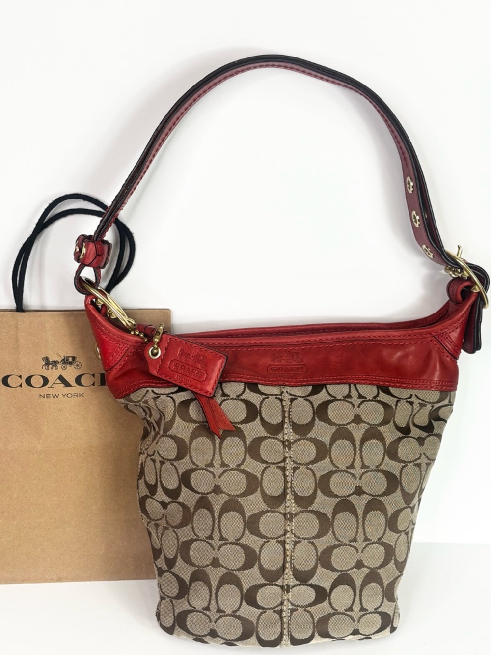 Vintage Coach Bucket Bag in Signature C Canvas & red leather trim.